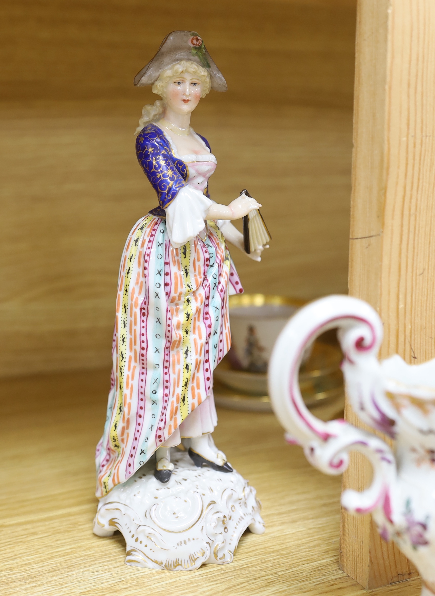 A group of European porcelain tableware to include a pair of figures, Lowestoft jug, Dresden cups etc.